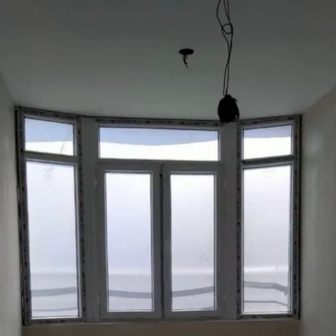 Bright farmhouse interior near Karachi with large uPVC bay windows